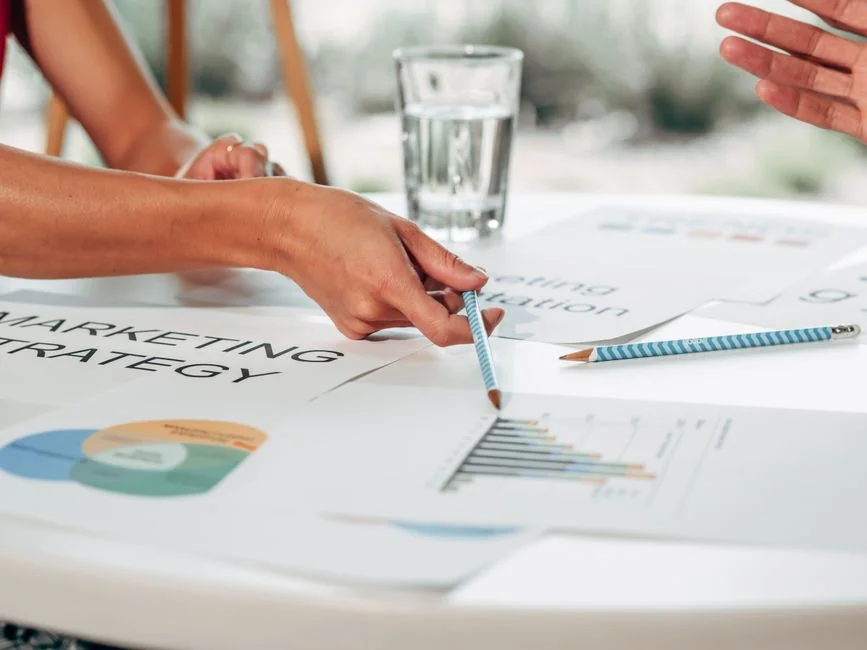 home-hero-bg Planner open on a desk with handwritten Holiday Email Marketing Series note.